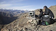 The local team set up and check a camera-trap positioned on a route used by snow leopards crossing these mountains.