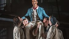 Roderick Williams as Billy Budd with members of the Chorus of Opera North