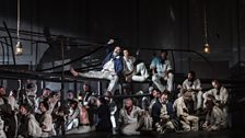 Stephen Richardson as Dansker and Roderick Williams as Billy Budd with members of the cast and the Chorus of Opera North