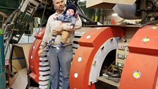 Alan Windsor, club captain, with his son on his first visit to the cart