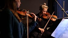 Marie Schreer (L) and Clarice Morrish Rarity (R) perform Constance for string quartet