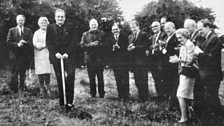 Rev. Eustace Cuts the First Sod