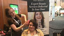 Stylist Lauren busy giving a blow-dry at Retail Week conference