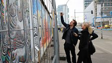 Berlin artist Christian Awe and Nikki Bedi recording by the East Side Gallery