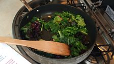 Kale cooking on the campervan hob