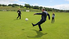 Michael kicks a ball at the GAA grounds in Ballymena