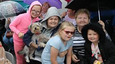 Families gather in the rain to see Hugo