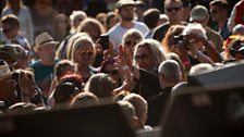 Nathan James from Inglorious high-fives a girl in the crowd