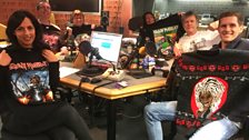 Presenters and Guests in the studio (holding Iron Maiden T-Shirts)