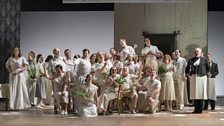 Giselle Allen as Míla Valková with members of the Chorus of Opera North