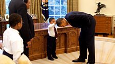 President Obama bows to 5-year-old Jacob Philadelphia, his arm raised to touch the president’s hair by Pete Souza