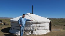 Opera singer Ariunbaatar by his family ger (yurt)