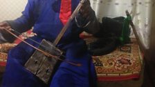 A traditional Mongolian morin huur (horse head fiddle) player