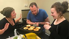 Neil and Flora admire Larah's bagels