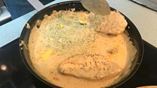 Chicken breasts poaching slowly in the whisky sauce