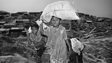 Children carry firewood at Kutupalong refugee camp