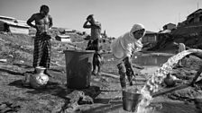 Families at a water pump in Kutupalong refugee camp