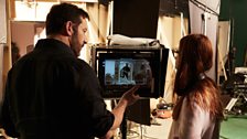 Jason Isaacs and Bonnie Wright on set