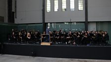 Sir Simon Rattle conducting the LSO in rehearsal at Tate Modern.