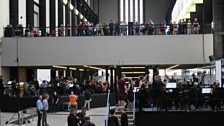 The LSO rehearses Stockhausen's Gruppen in the Turbine Hall, Tate Modern.