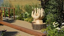 The bridge over stream is designed to represent an amputee reaching out to the charity