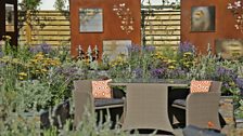 A steel water wall and granite vortex provide sound and dynamism in this garden celebrating the 150th anniversary of the RNIB