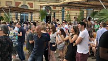 Festival goers dance to Norman Jay MBE