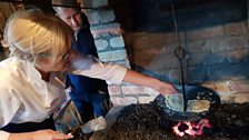 Leslie Morrow keeps an eye on Arlene Thompson's apple fadge on the griddle