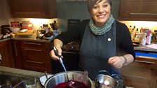 Kay making her home made mixed berry jam