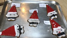 Santa cookies going into the oven