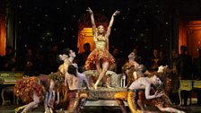 Solo dancer Martha Nichols (center) in Act II, Scene 2 of Verdi's "La Traviata."