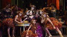 Kirstin Chávez (center) as Flora Bervoix in Act II, Scene 2 of Verdi's "La Traviata."