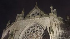 Exeter Cathedral West Front at night.