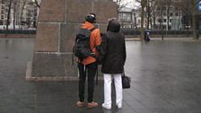 Proinsias and Donna share a moment by the base of the sculpture