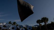 The inverted umbrellas in place and the Aerocene balloon sculpture flying in the sun and wind - free of fossil fuel