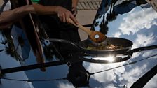 Finished inverted umbrellas that, as well as reflecting the sun's heat towards the hot air balloons, doubles as a solar stove