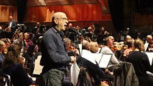 Ken Bruce soundchecks on stage with the tv Concert Orchestra