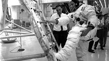 Neil Armstrong practises climbing into Apollo 11's Lunar Module