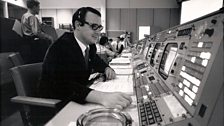 Flight controller Stephen Bailes at mission control console