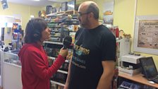 Julie chats to shop-owner Keith about Henchman's