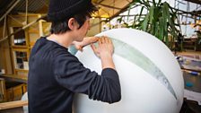 The strips of the map (called gores) are stretched and glued onto the sphere