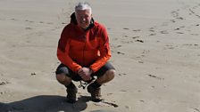 Derek on Cefn Sidan beach with a jelly fish