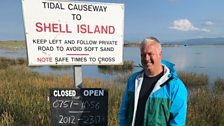 Derek next to the Shell Island tidal causeway sign