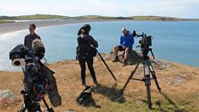 Crew filming at Cemlyn Bay