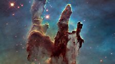 Pillars of Creation. The pillars are about 5 light-years tall, bathed in ultraviolet light from a group of young, massive stars