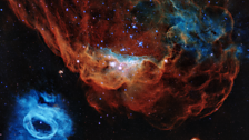 A spectacular visualisation of Hubble's 30th anniversary image - showing the Giant Red Nebula and its smaller blue neighbour.
