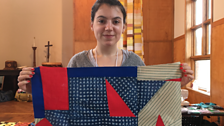 Zoe with her red triangle quilt