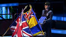 The Book of Remembrance is placed on the drum altar by Flt Lt Laura Foster