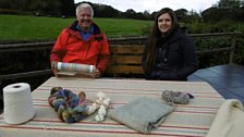 Derek learning to weave with Tasha Middleton