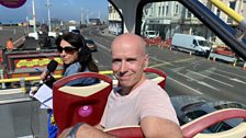 Stephen Cranford on board the open top bus